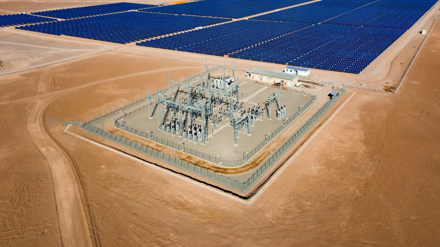 Aerial view of a substation next to a solar plant